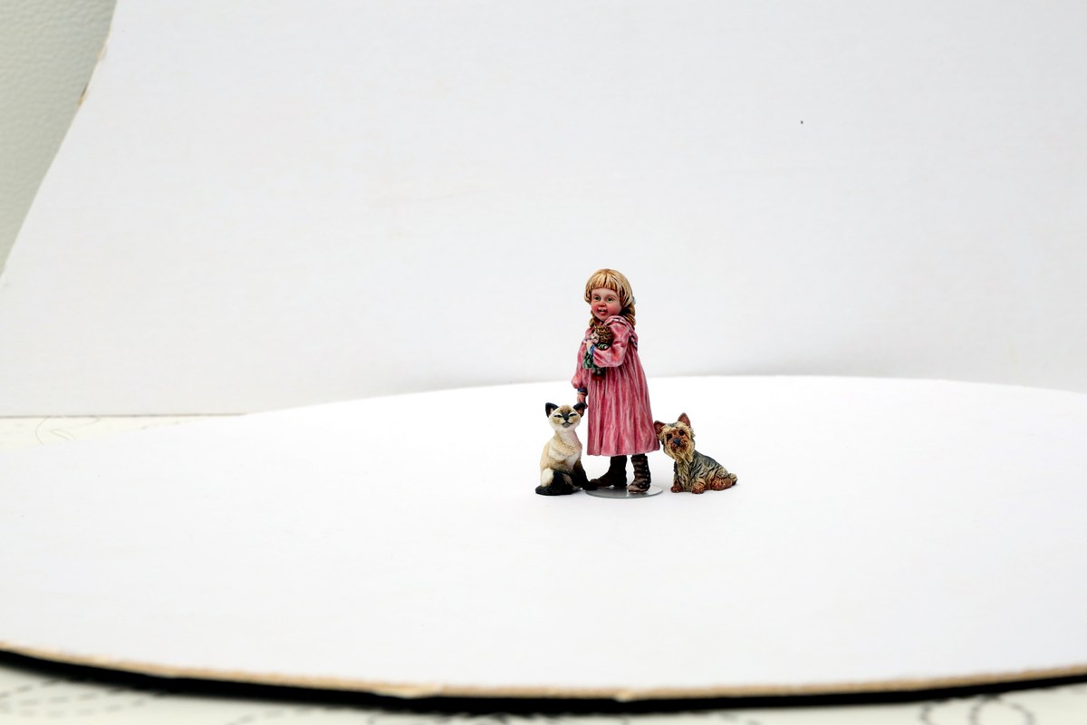 Figure with companion dogs